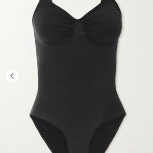 SKIMS bodysuit. Seamless Sculpt Brief Bodysuit in shade onyx (black)